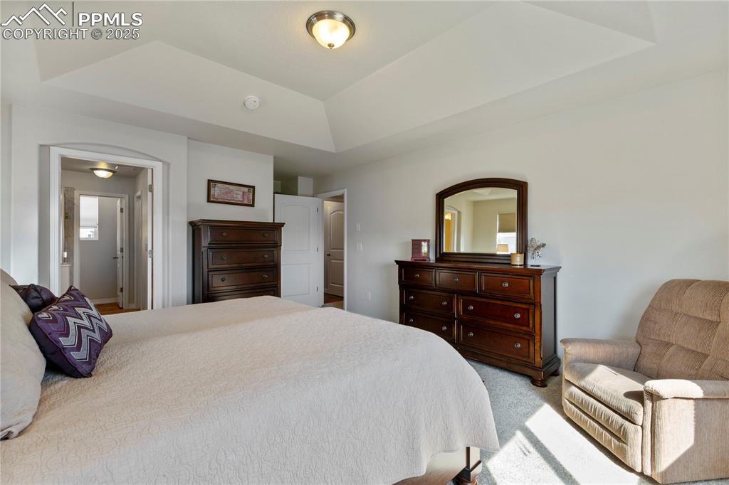 Image 16 of 38: Another view of primary bedroom