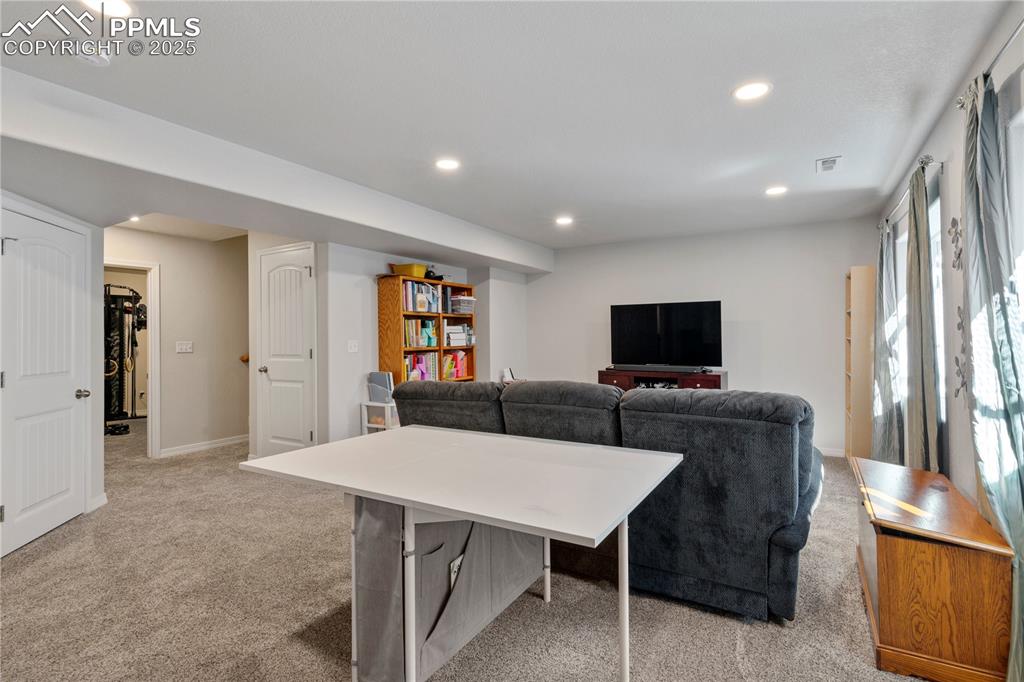 Image 24 of 38: Another view of family room in basement