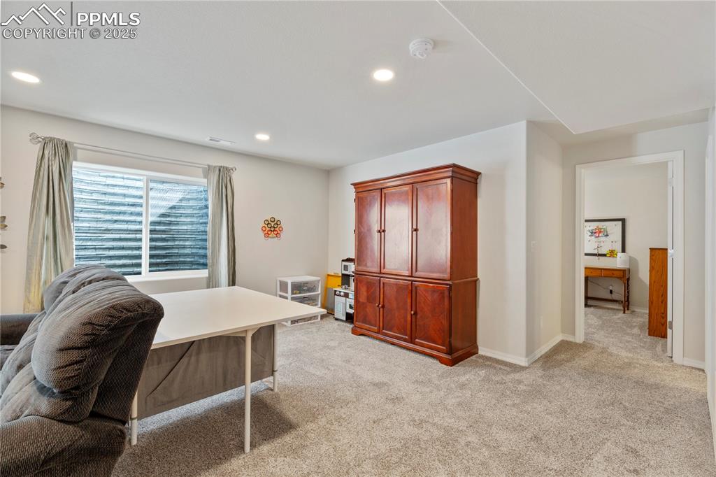 Image 25 of 38: Another view of family room in basement