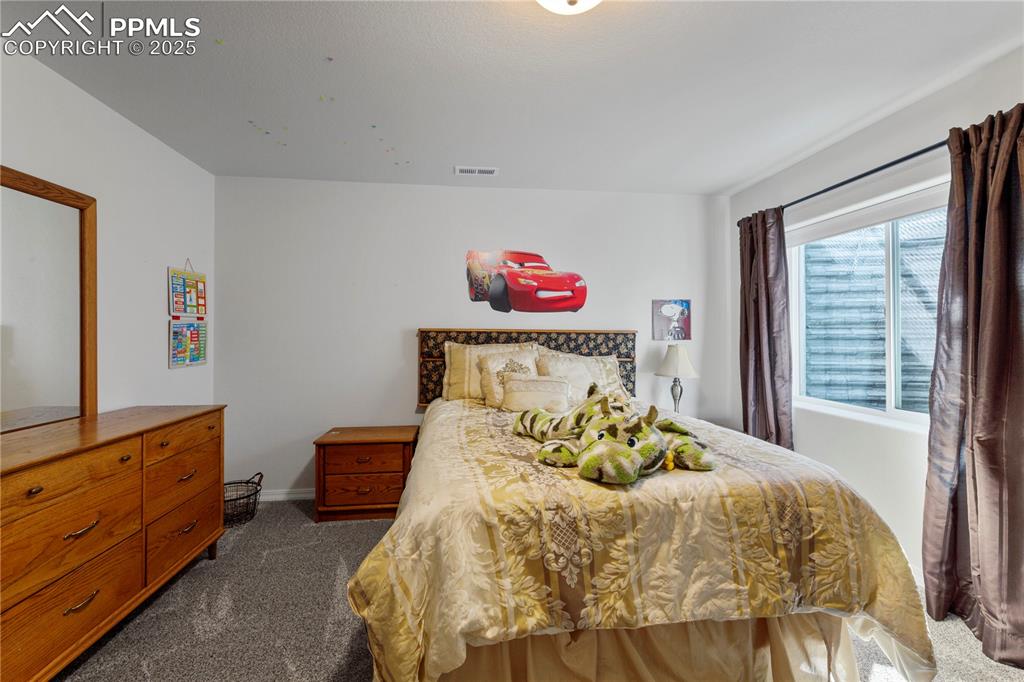 Image 26 of 38: Bedroom #5 located in the basement