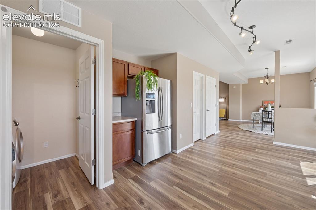 Image 10 of 33: Oversized Kitchen and Entry to Laundry Room