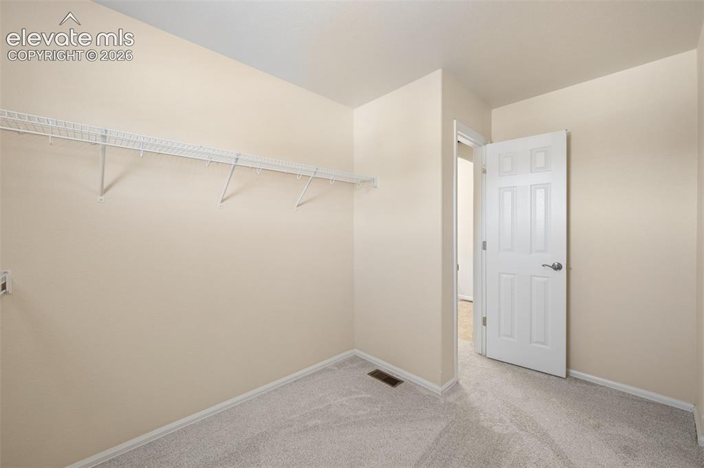 Image 14 of 33: Primary Bedroom Oversized Walk In Closet
