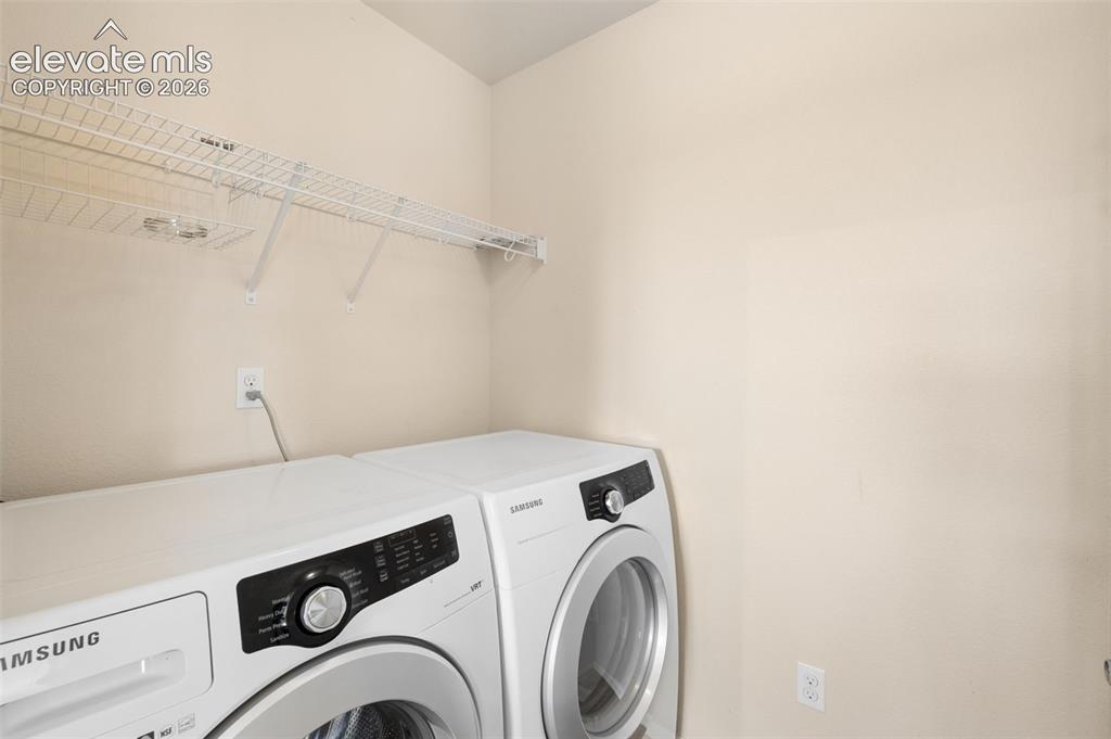 Image 28 of 33: Laundry Room Located Directly Off Kitchen For Easy Access