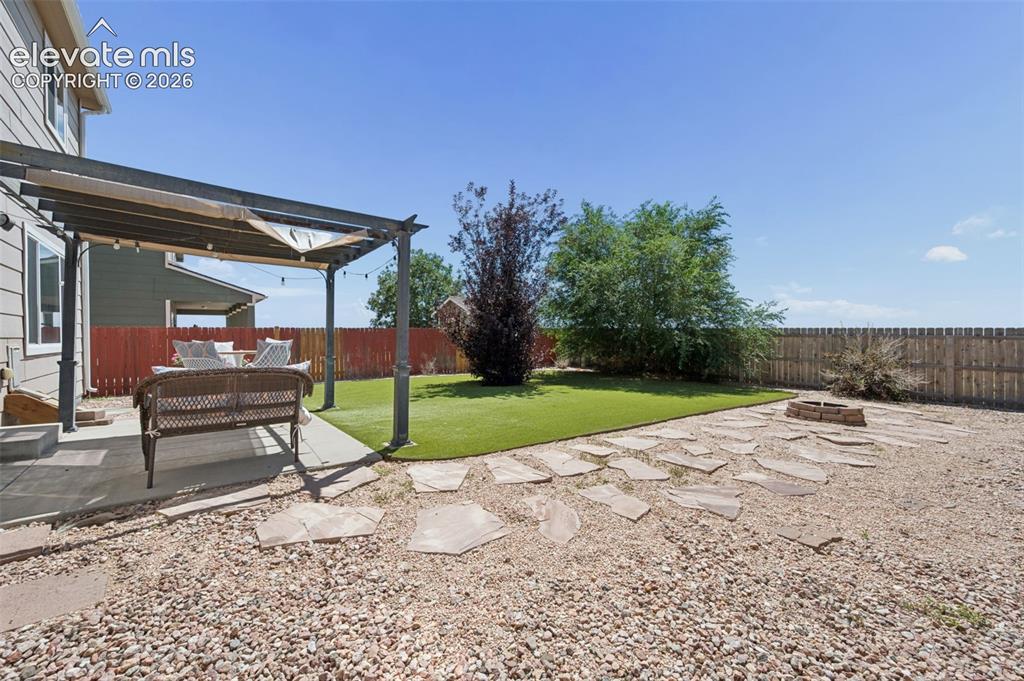 Image 29 of 33: Huge Fenced In Backyard With Pergola