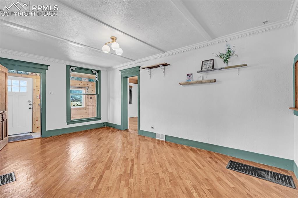 Image 10 of 50: Living Room off Main Entry with access to main bedroom