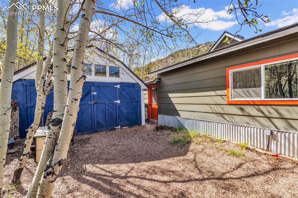 Image 41 of 50: Fenced back yard with access to detached garage.