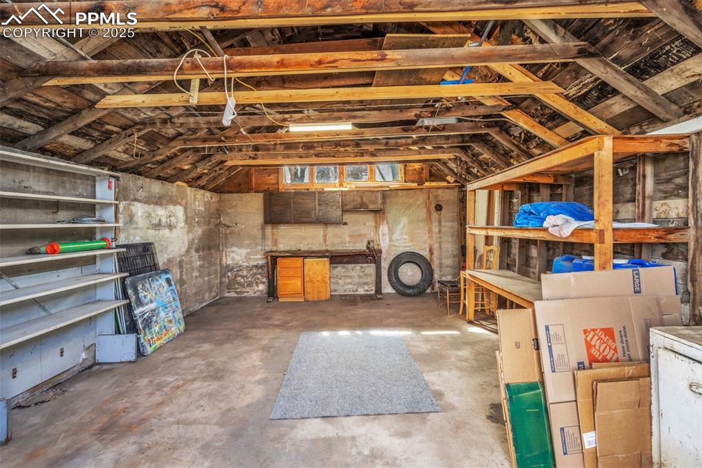 Image 46 of 50: Garage interior with ample storage space.