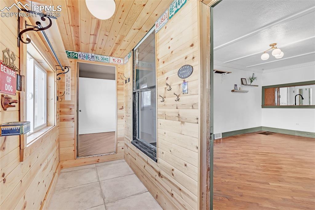 Image 7 of 50: Hall off the main entry leading to main bedroom and living room