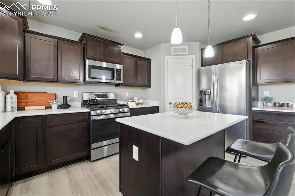 Image 20 of 45: Kitchen with appliances with stainless steel finishes, a kitchen breakfast 