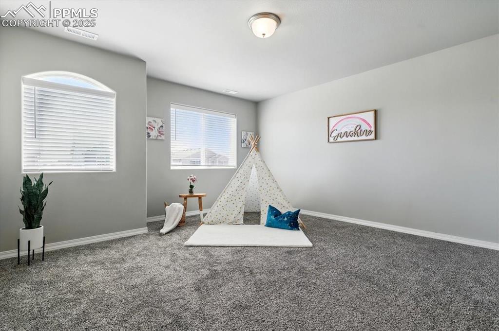 Image 21 of 45: Playroom with carpet and baseboards