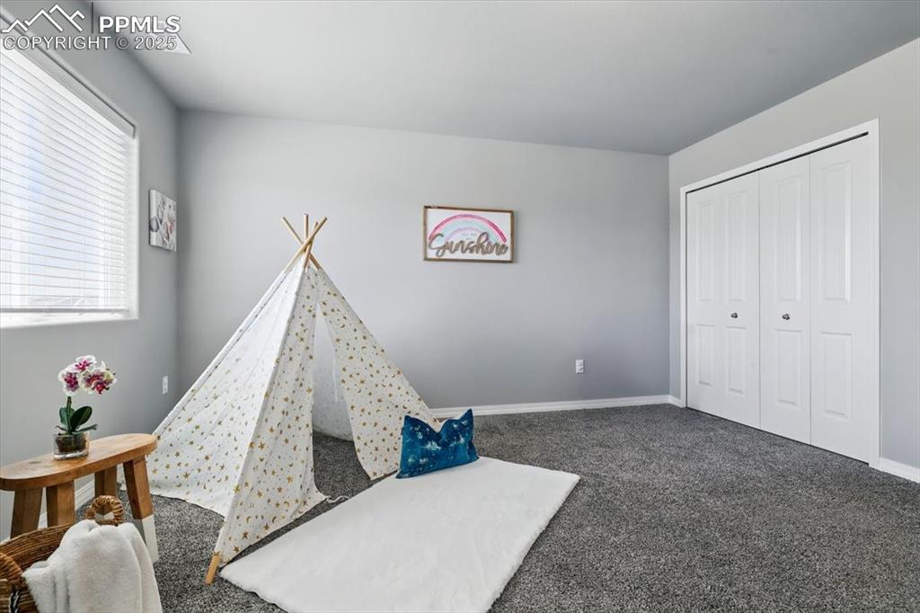 Image 22 of 45: Playroom with carpet and baseboards