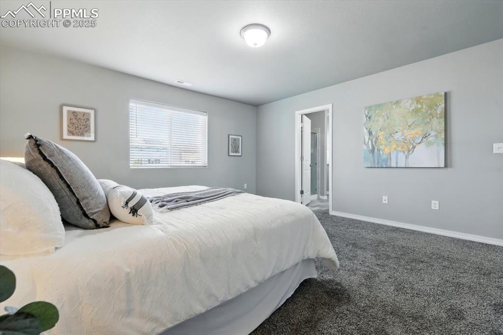 Image 26 of 45: Carpeted bedroom featuring baseboards