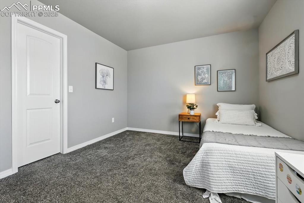 Image 31 of 45: Carpeted bedroom with baseboards