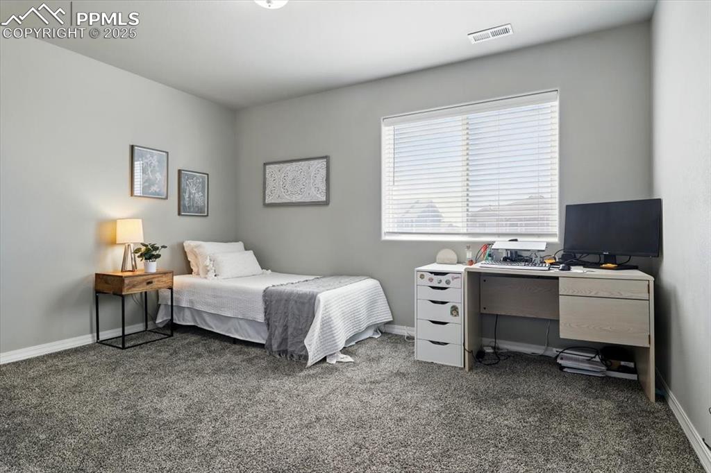 Image 32 of 45: Bedroom with carpet flooring and baseboards
