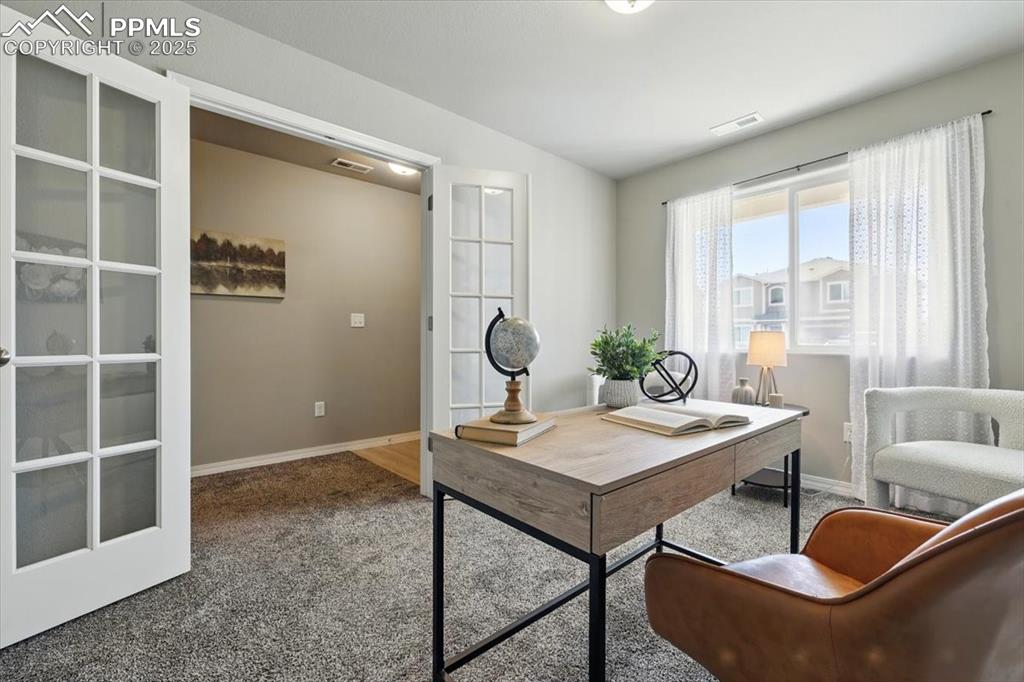 Image 5 of 45: Home office with carpet and baseboards