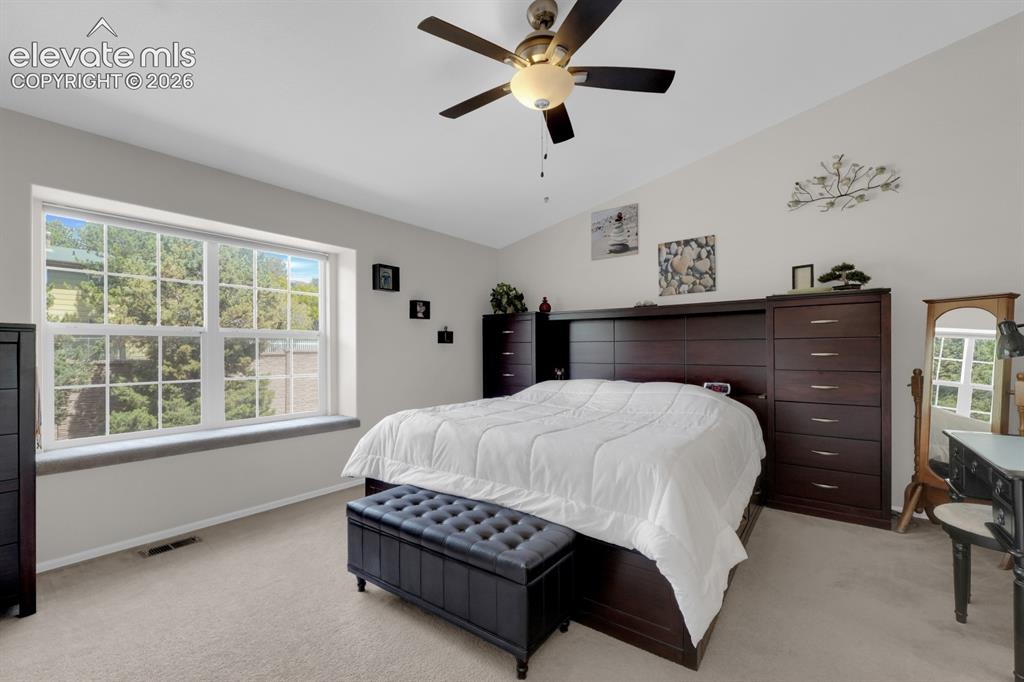 Image 11 of 26: Primary bedroom with ceiling fan