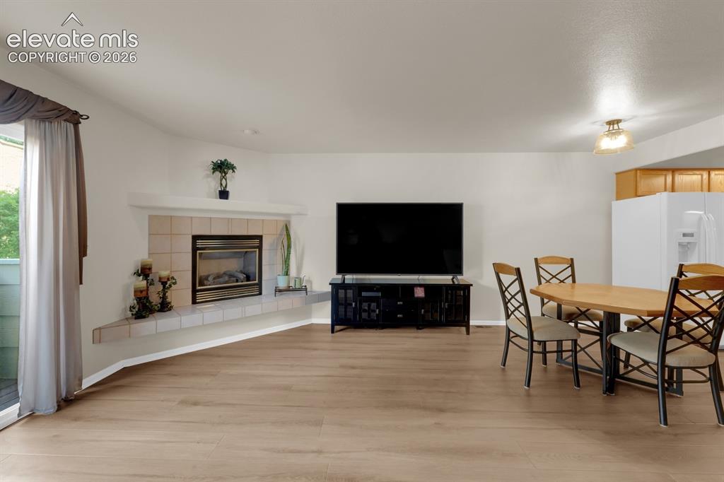 Image 9 of 26: Open-concept living area with fireplace