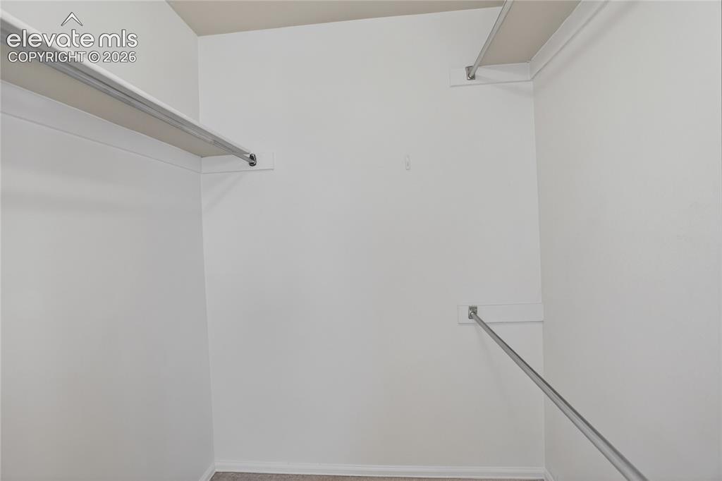 Image 16 of 16: Primary walk-in closet