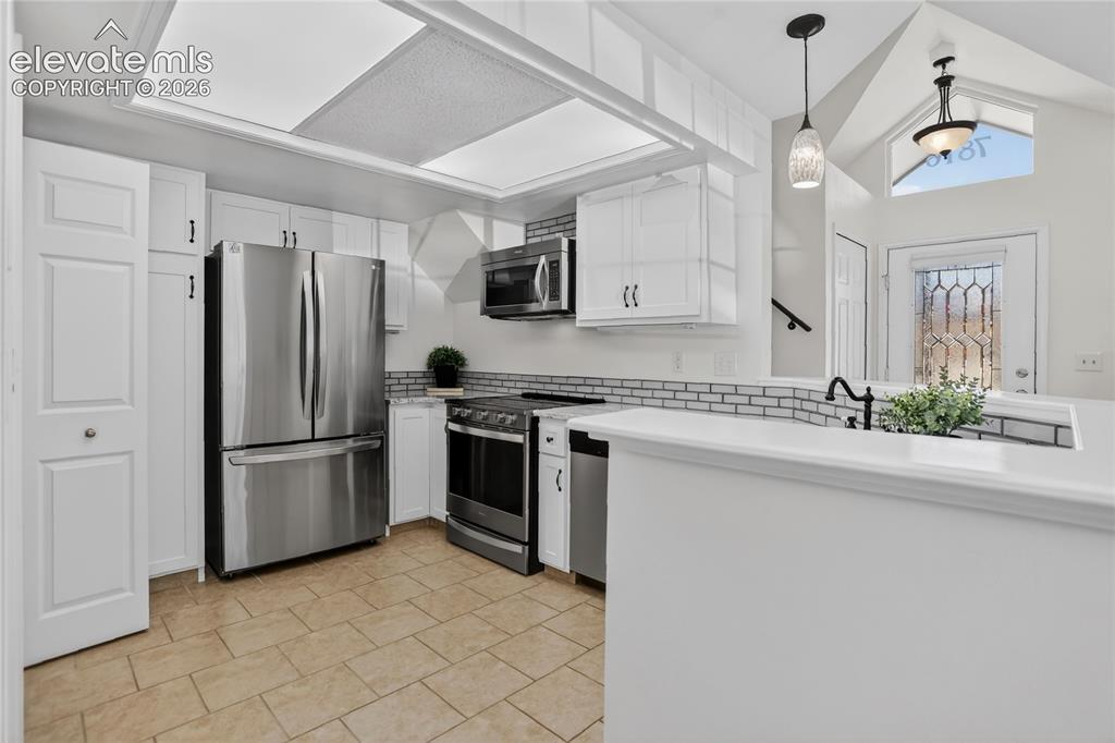 Image 5 of 16: Kitchen w/ SS appliances