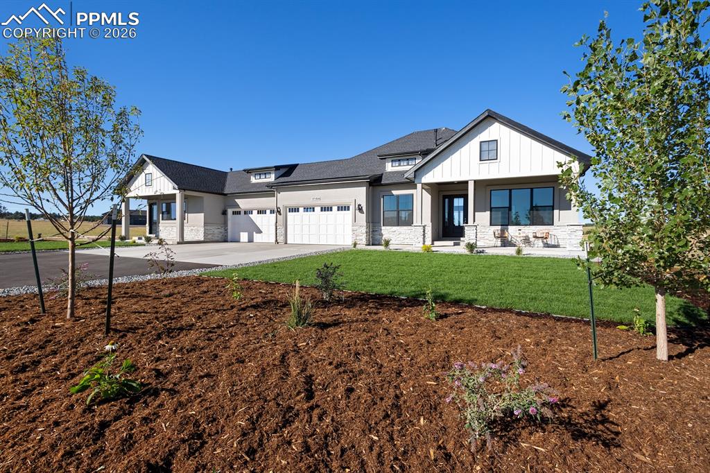 Image 1 of 35: Front Elevation with attached secondary living quarters.