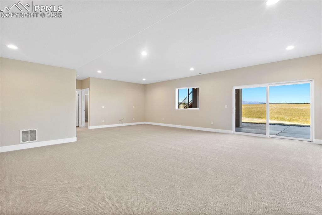 Image 22 of 35: Walk out basement rec room