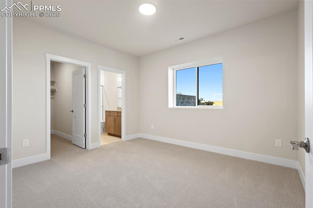 Image 24 of 35: Basement bedroom with attached bath 2