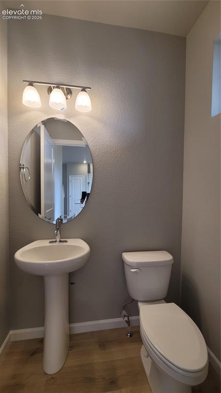 Image 17 of 32: Powder Room, conveniently located on the main level with Living room and Ki