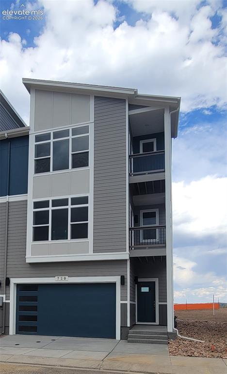 Image 2 of 32: Peak View-End Unit-Backs to Open Space-3 Story-Modern Elevation-2 Car Garag