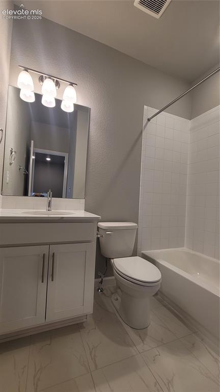 Image 22 of 32: Full Bathroom with quartz countertop, tile surrounds, located on the upper