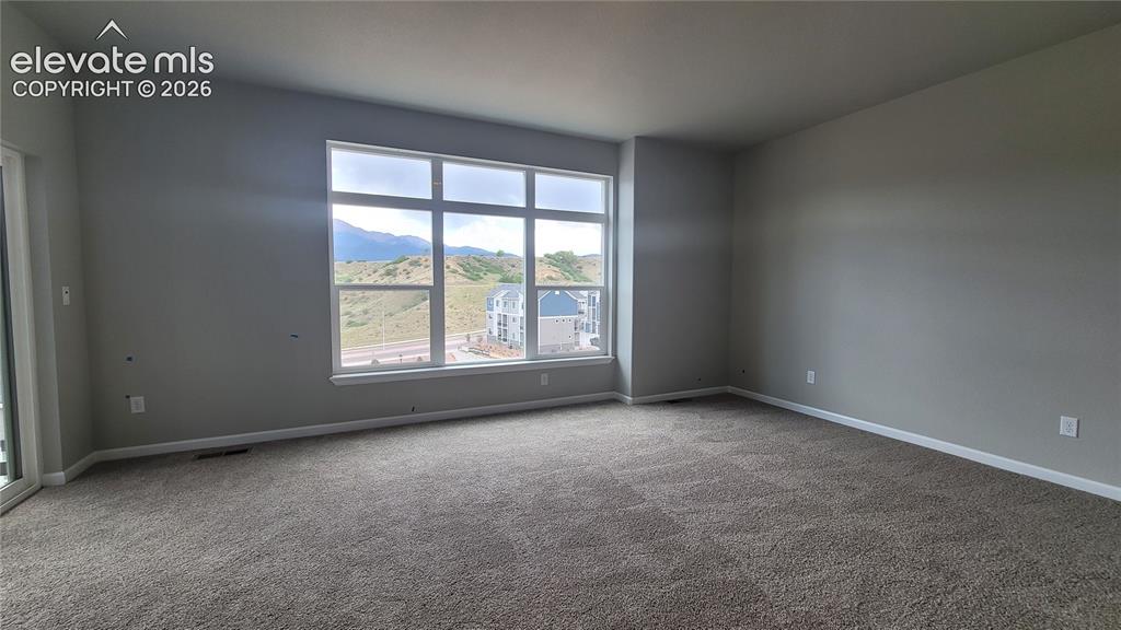 Image 24 of 32: Primary Suite is accompanied with a 3/4 bathroom, walk-in closet, and a pri