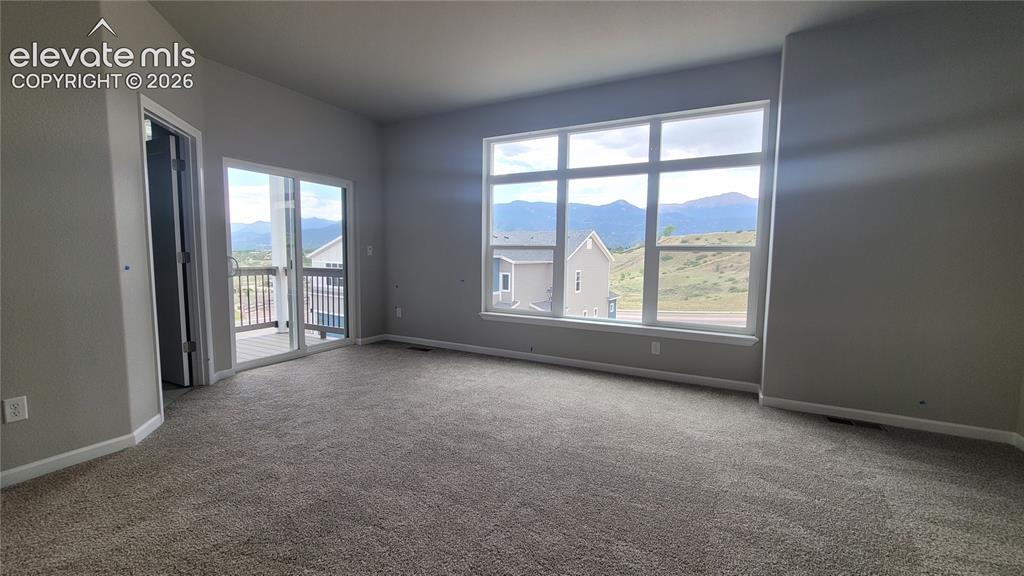Image 25 of 32: Primary Suite is accompanied with a 3/4 bathroom, walk-in closet, and a pri