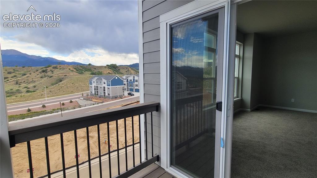 Image 28 of 32: Primary Suite walks out to composite deck!