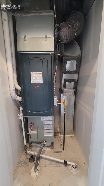 Image 29 of 32: Utility closet with a 96% energy efficient furnace, located on the upper le