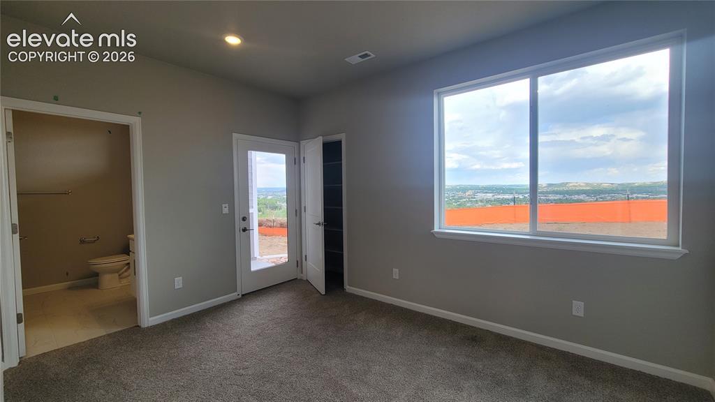 Image 4 of 32: Junior Suite at Entry Level with a 3/4 bathroom, linen closet, closet, and