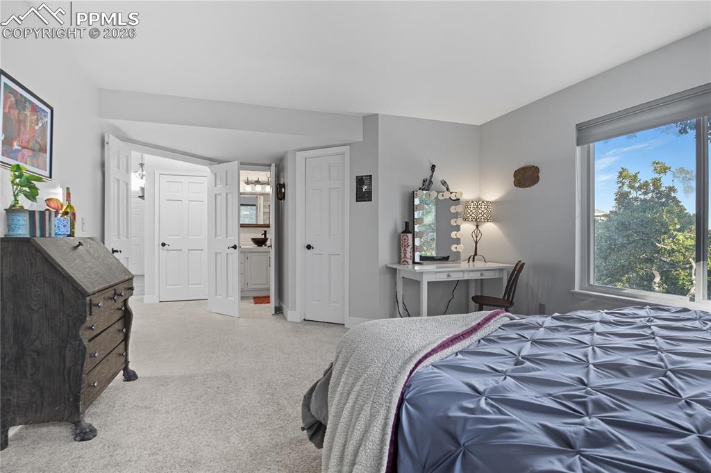 Image 24 of 45: Bedroom featuring light carpet