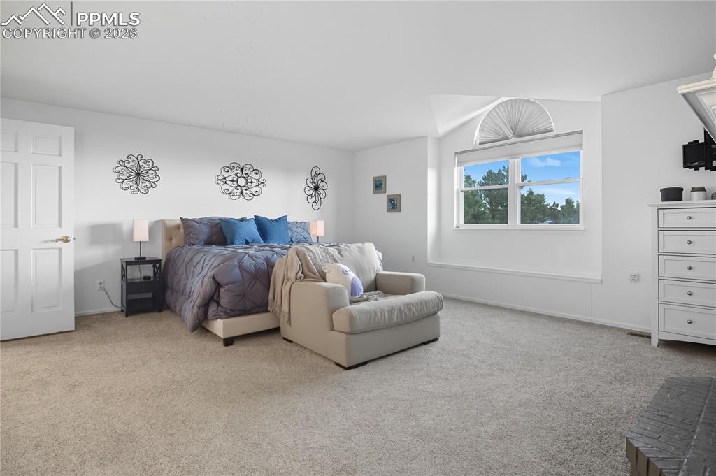 Image 32 of 45: Bedroom featuring light carpet and baseboards