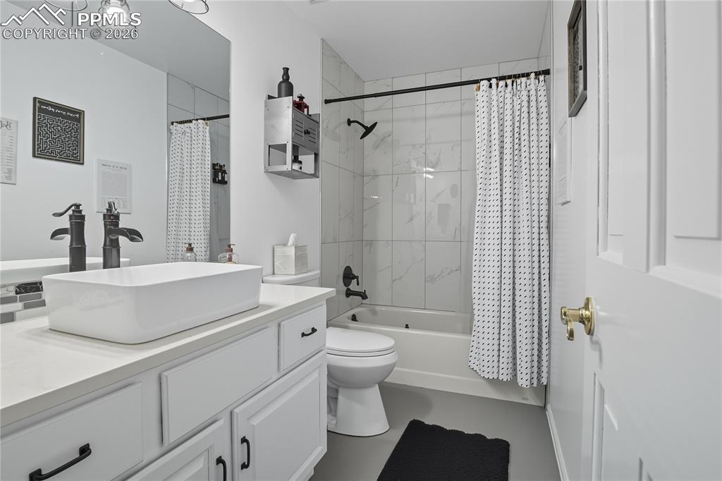 Image 35 of 45: Bathroom featuring vanity and shower / bath combo