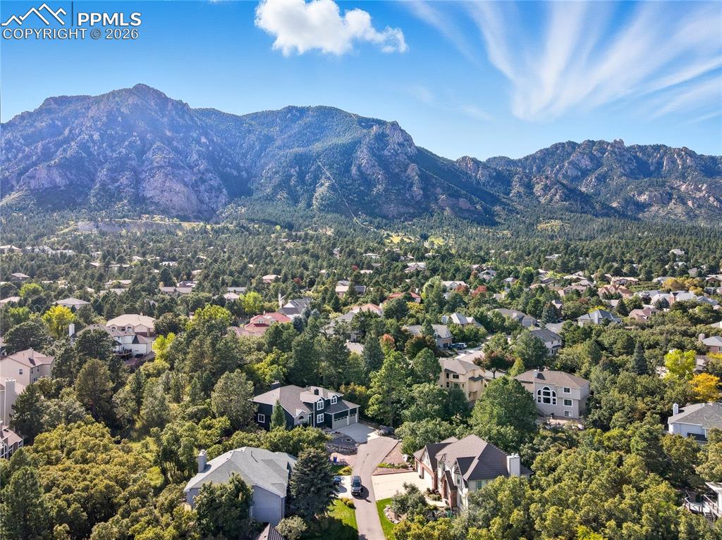 Image 41 of 45: Aerial view of residential area with a mountain backdrop