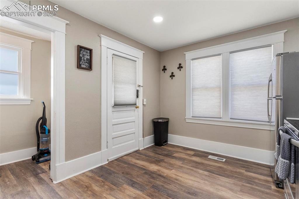 Image 12 of 43: Entrance foyer featuring dark wood finished floors, baseboards, and recesse