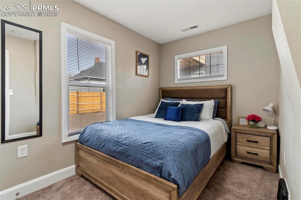 Image 32 of 43: Carpeted bedroom featuring baseboards