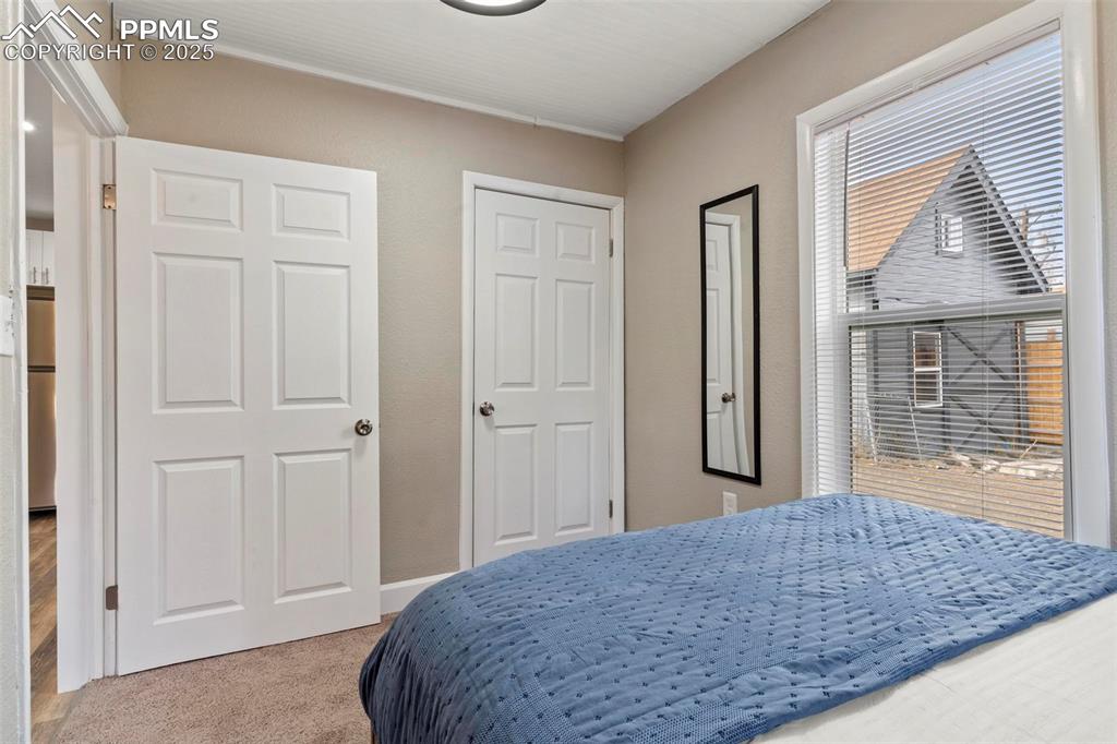 Image 33 of 43: Bedroom with carpet