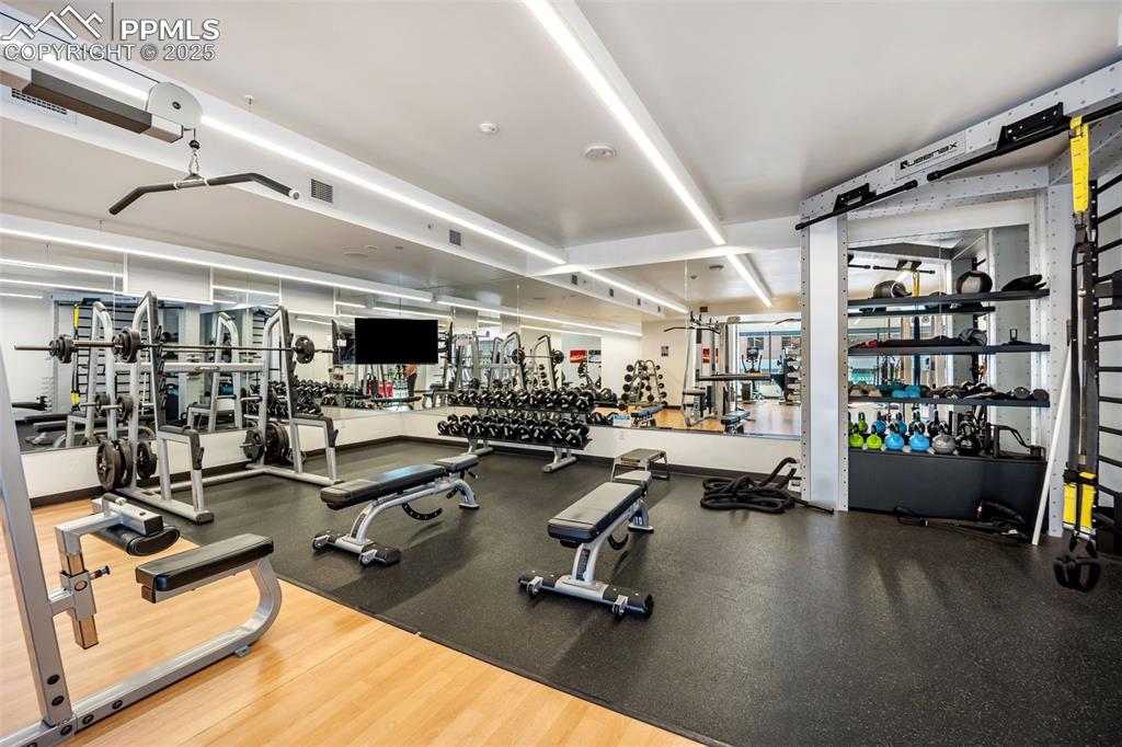 Image 20 of 50: View of exercise room with weights
