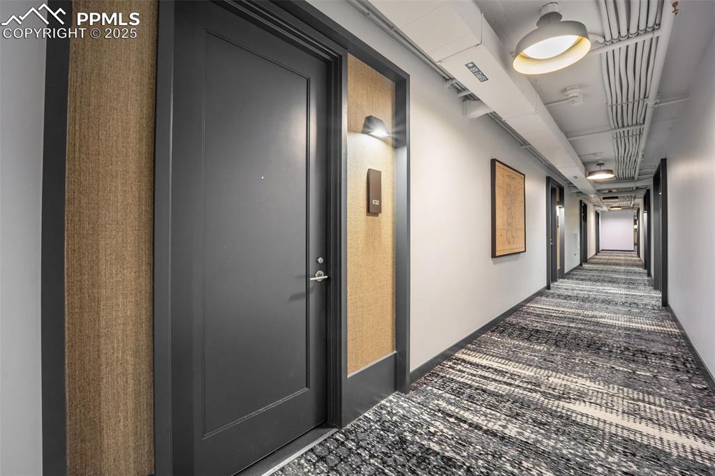 Image 24 of 50: Hall featuring carpet floors