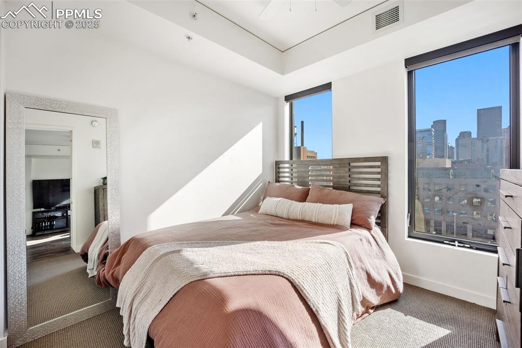 Image 39 of 50: Carpeted bedroom with baseboards