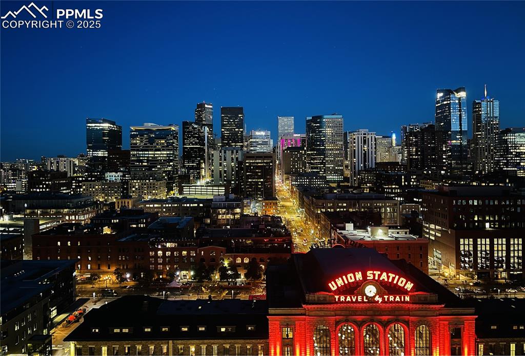 Image 49 of 50: View of city at night from the building