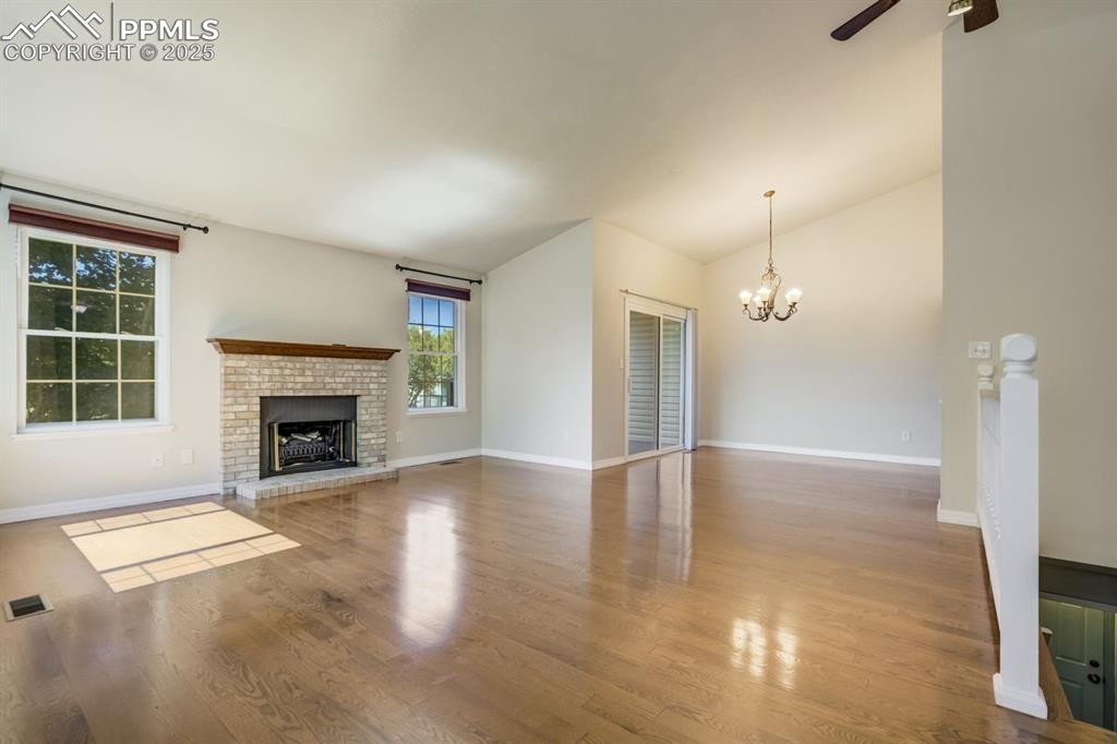 Image 11 of 41: Beautiful gleaming hardwood floors in the living room.