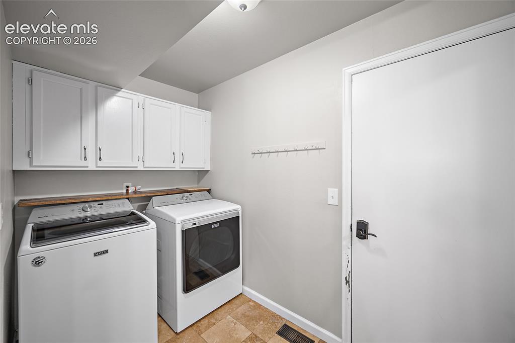 Image 13 of 43: Walks out to the garage and pantry is off of here