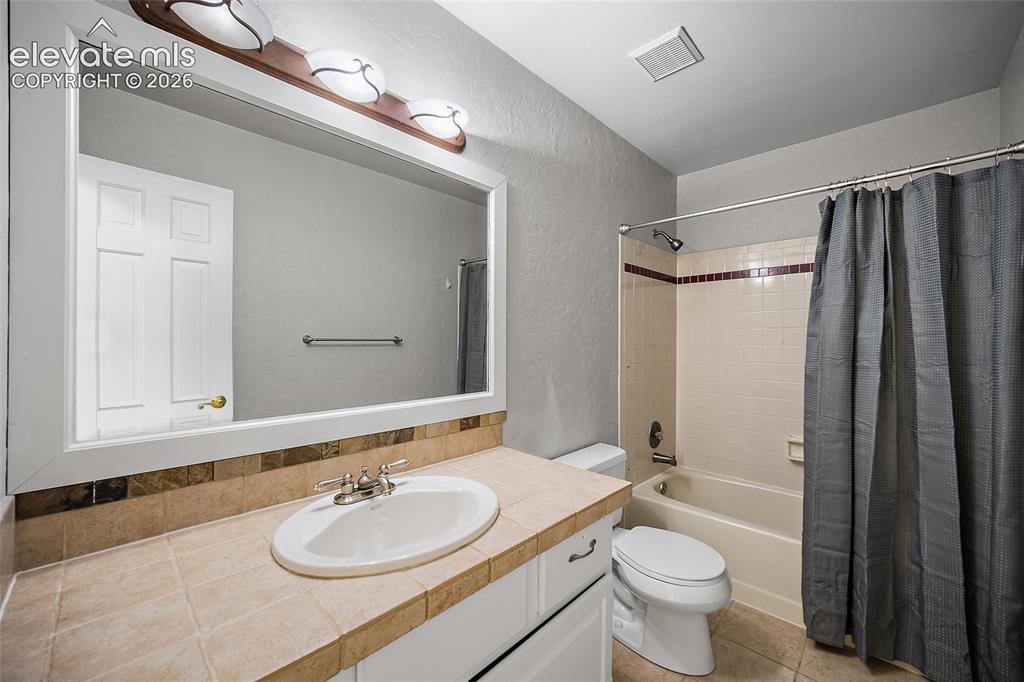 Image 27 of 43: Upstairs Bathroom for Bedrooms #3 & #4 to share