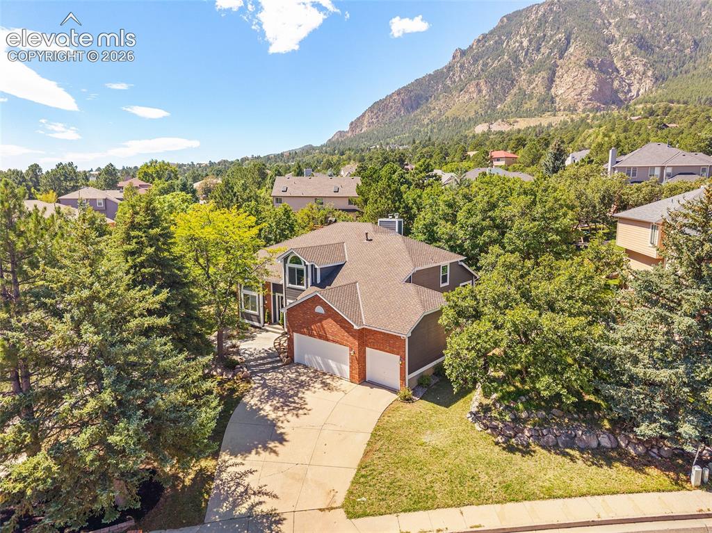 Image 41 of 43: Nestled in the trees and mountain backdrop