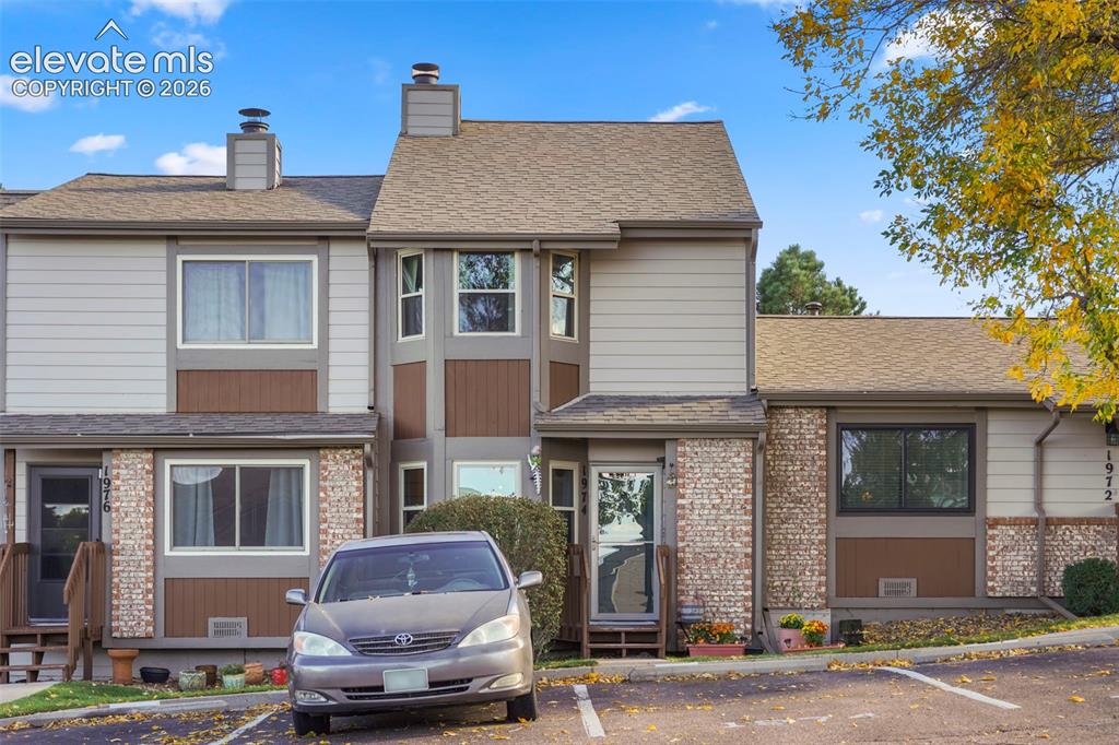 Caption: Multi-level exterior featuring a combination of horizontal siding, paneling, and masonry accents, mu